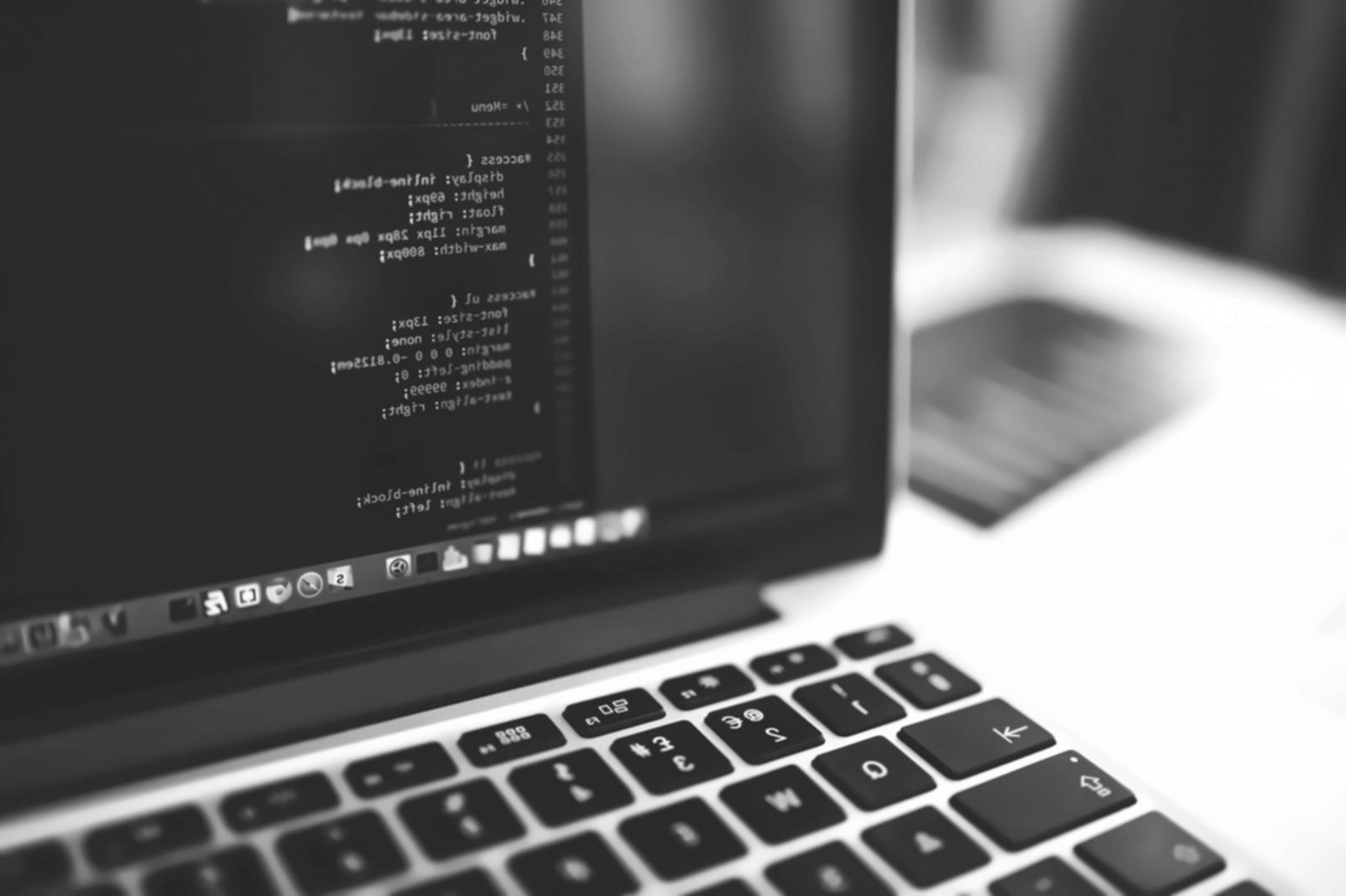 Game development code editor showing JavaScript game logic and debugging tools